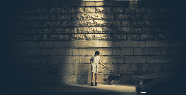 photo of person under light on street