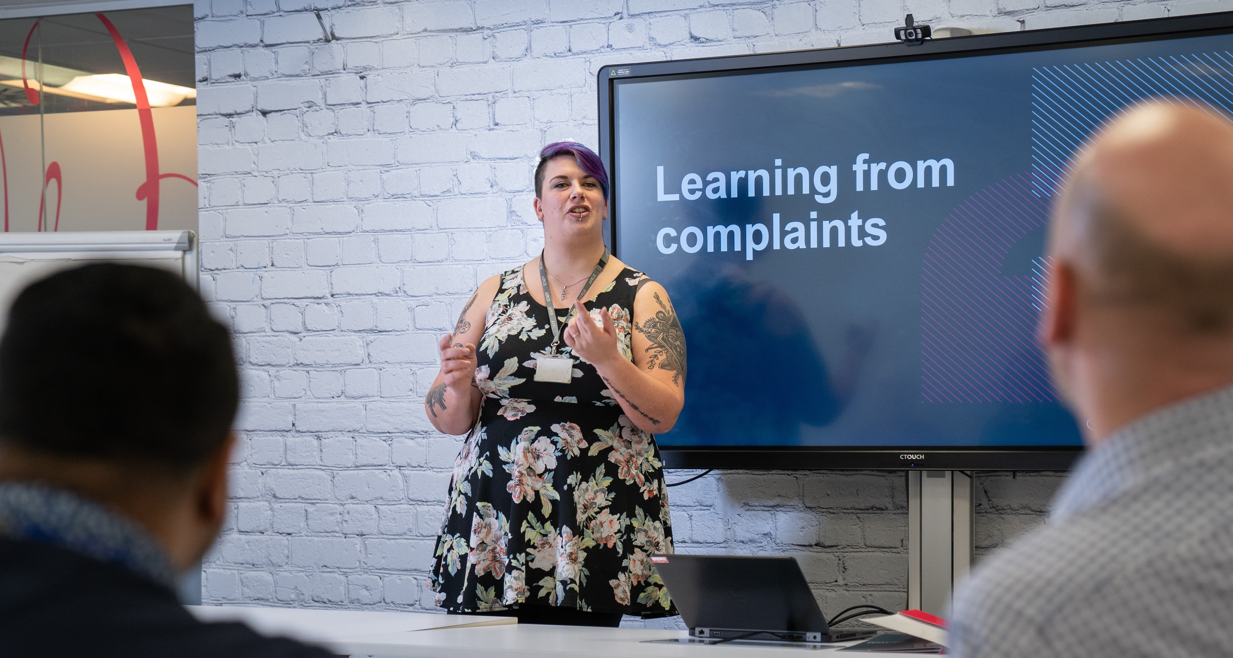 Female ombudsman talking at an event