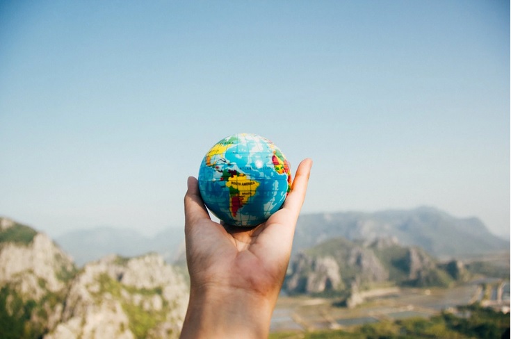 image of a globe in someone's hand